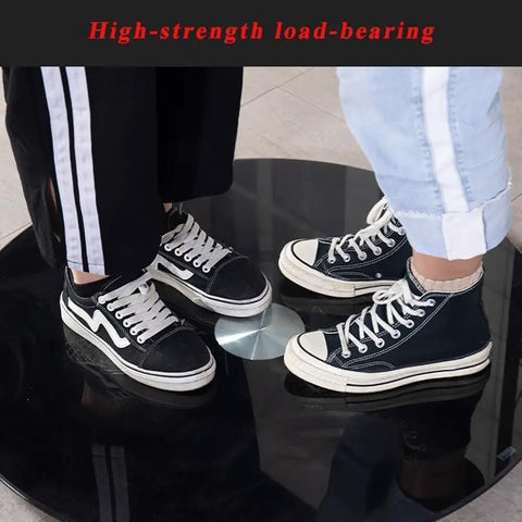 Heavy Duty Tempered Glass Rotating Serving Tray With Premium Steel Bearings Massive Lazy Susan table showing shoes on black surface.
