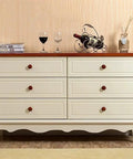 Heavy Duty Round Wood Drawer Knobs For Dressers And Cabinets, Slick Red Brown Finish With Hassle Free Mounting Screws, Pro Level Furniture Pull Handles Set Of Ten on a cream dresser.