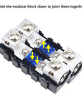 Built Tough Modular Inline Fuse Block Kit Featuring ANL To Mini ANL Holders For 1 0 2 4 Gauge Wires with connectors and fuses on a black board.
