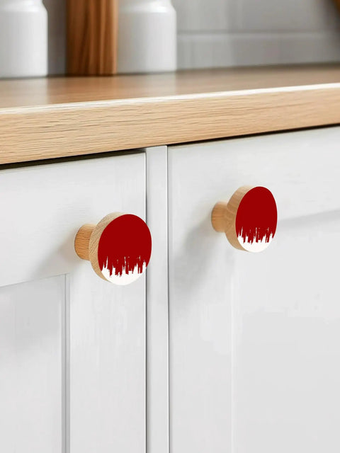 Top Tier Beech Wood Cabinet Knobs Round Drawer Pulls One Point Four Inch Abstract Graffiti Vibe Red And White Painted Furniture Hardware on white cabinets.