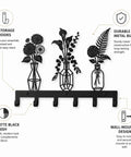 Knockout Premium Decorative Floral Metal Wall Coat Rack Featuring Six Heavy Duty Hooks And Matte Black Finish displayed with hooks and floral design.