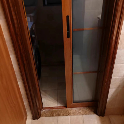 Heavy Duty Aluminum Window Pulley With Double Copper Wheels And Precision Bearings For Smooth Gliding Sliding Systems in use on a sliding door.