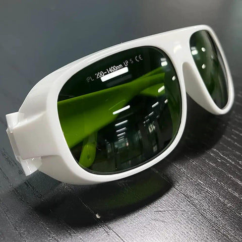 Real Deal Heavy Duty Laser Safety Glasses For Ipl Hair Removal And Salon Operators Featuring Full Coverage Eye Shield And Ultraviolet Blocking Protective Lens in white with green lenses.