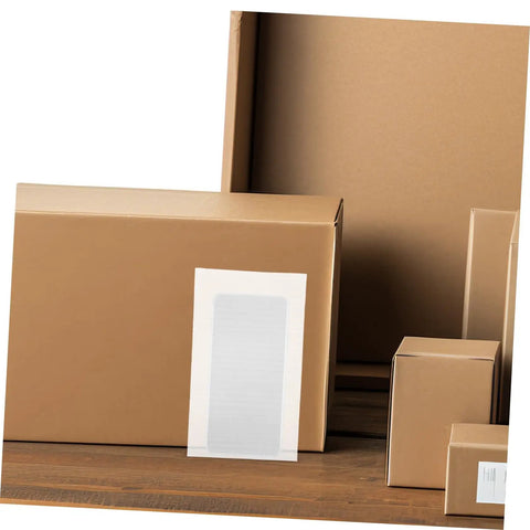 Brown shipping boxes with labels on a wooden surface, showcasing Premium Foam Packing Sheets For Shipping And Storage 100 Pack.