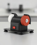 Compact Bench Top Grinder With Rock Solid Base Dual Sharpening Wheels smooth vibration control in a black frame on a workbench.