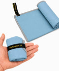 Ultralight Backpacking Quick Dry Microfiber Towel For Camping And Hiking, soft blue towel folded with loop strap in person's hand