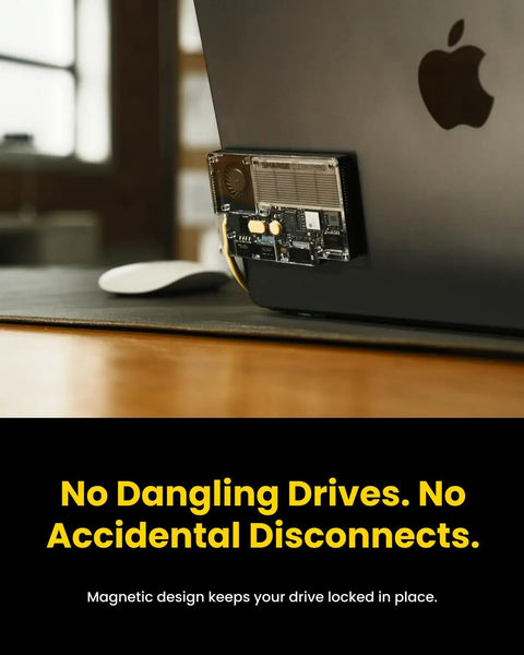 All In One Portable 1TB SSD With Active Cooling Fan And Built In 4 Port Hub HDMI 2 1 attached to MacBook, magnetic design