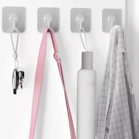 Heavy Duty Adhesive Wall Hooks 25 Pack No Drill Mounting Waterproof Kitchen Bath Organizer Holds Fifty Lbs Easily in use with various items.