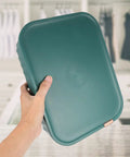 Slick Multi Compartment Heavy Duty Plastic Drawer Storage Container With Secure Top displayed in hand, ideal for organizing socks and undies.