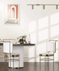 Interior dining space with cream white matte peel and stick wallpaper, showing wall decor and furniture.