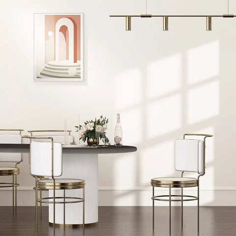 Interior dining space with cream white matte peel and stick wallpaper, showing wall decor and furniture.