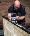 Person using All-In-One Adjustable Door Hinge Jig Installation Kit For 2 Ft 6 In To 9 Ft Doors with router bit in workshop