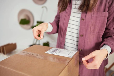 Person sealing a box with Heavy Duty Clear Packing Tape Refills, 6 Rolls, Strong Adhesion For Shipping, Moving And Storage, Transparent Packaging