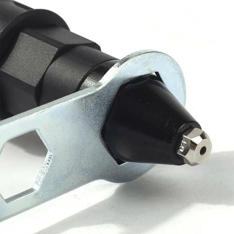 Close-up of Tough As Nails Cordless Rivet Gun Drill Adapter nozzle with interchangeable tips for nut setting.