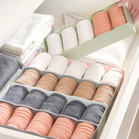 Six Piece Pink Plastic Underwear Drawer Organizer Set Smooth Dresser Storage Dividers with neatly arranged socks in drawer.