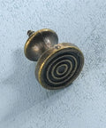 Slick 10 Piece Mini Drawer Knobs With Solid Antique Brass Finish and Hella Durable Rustproof Metal Hardware For Sweet Cabinet Makeovers Including No Sweat Self Tapping Screws For Quick DIY Swaps - close-up view of swirl design