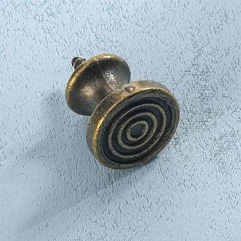 Slick 10 Piece Mini Drawer Knobs With Solid Antique Brass Finish and Hella Durable Rustproof Metal Hardware For Sweet Cabinet Makeovers Including No Sweat Self Tapping Screws For Quick DIY Swaps - close-up view of swirl design