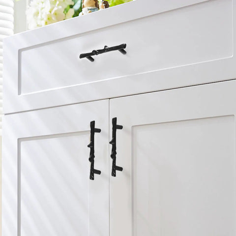 Heavy Duty Black Tree Branch Cabinet Pulls on white kitchen cupboards showcasing rustic twig design and durable zinc alloy material.