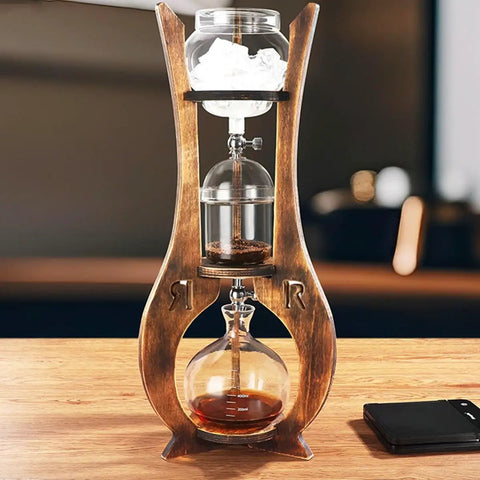 Kickstart Your Routine With This Cold Brew Drip Tower And Portable Iced Coffee Maker Featuring Dual Adjustable Valves For Custom Drip Rates Crafted From Durable Borosilicate Glass For A Smooth Daily Grind, displaying ice, coffee grounds, and brewed coffee.