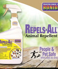 Repels All Animal Repellent Ready To Use Spray 32 Oz displayed with pet-safe label on wooden surface outdoors