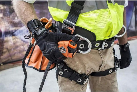 Worker using heavy duty tool lanyards 20 pack safety leashes with retractable bungee cord aluminum lock carabiner on tool belt.