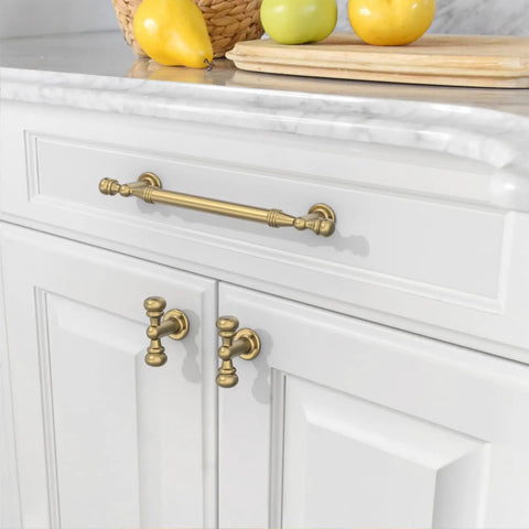 Top Shelf Champagne Bronze Cabinet Pulls With Five Inch Hole Centers on white kitchen cabinets with fresh fruit decor.