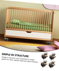 Heavy Duty Universal Cabinet Casters 4 Pack With 2 Inch Vintage Brass Finish attached to a wooden crib for easy mobility.