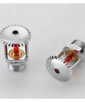 Beefed Up Fire Defense Delivers Hardcore Safety With Five Premium Heat Triggered Sprinkler Heads Made From Solid Brass And Half Inch Pipe Threads For Lightning Quick Mist Spread When You Really Need It Most, showing two upright brass sprinkler heads.