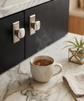 Modern Zinc Alloy Cabinet Knobs With Backplates Round Drawer Knobs for kitchen shown on dark wood cabinet with marble counter