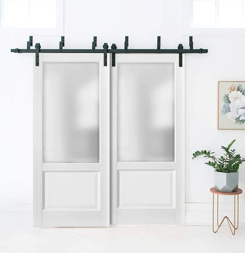 Top Shelf Double Sliding Barn Doors With Frosted Opaque Glass And Clean White Silk Finish Includes Beefy Six Foot Six Inch Steel Track Rig With Full Hardware Setup For 72InchBy96Inch Rooms view of double sliding doors in a bright interior.