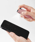 Touchscreen Mist Cleaner Kit With Spray And Wipe Pink Pocket Size Screen Cleaner For iPhone Android iPad MacBook Laptop Monitor Car Displays Tesla Reusable Easy To Carry Quick Dry After Cleaning in use on smartphone screen