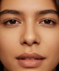 Close-up of a model wearing an Implant Grade Titanium Nose Stud 20G with Cubic Zirconia sparkle, perfect for sensitive skin.