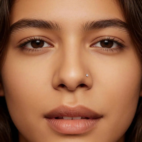 Close-up of a model wearing an Implant Grade Titanium Nose Stud 20G with Cubic Zirconia sparkle, perfect for sensitive skin.