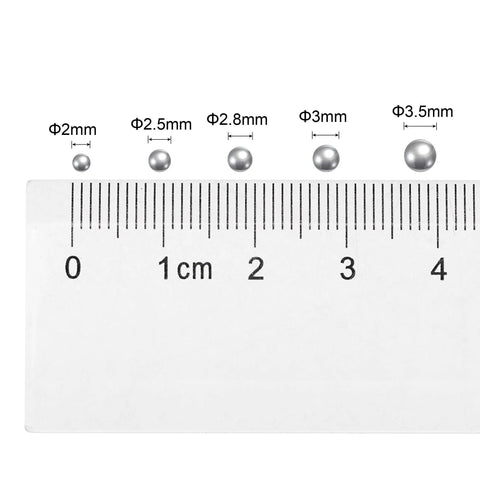 Sick Precision 2Mm Carbon Steel Ball Bearings G1000 Grade Miniature Round Balls shown in size comparison with a ruler.
