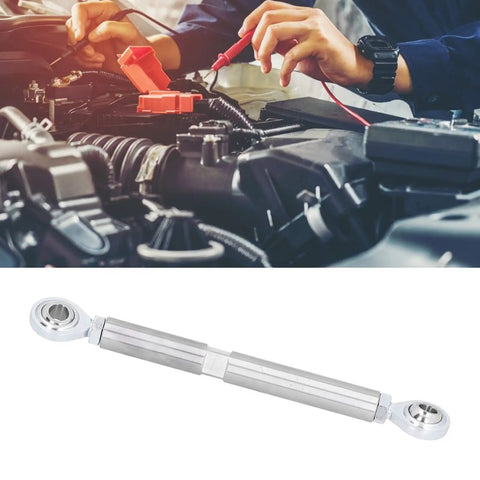 Gear Head Favorite Adjustable Alternator Tensioning Rod Bracket Seven Inch Stainless Steel auto parts under mechanic's hands.