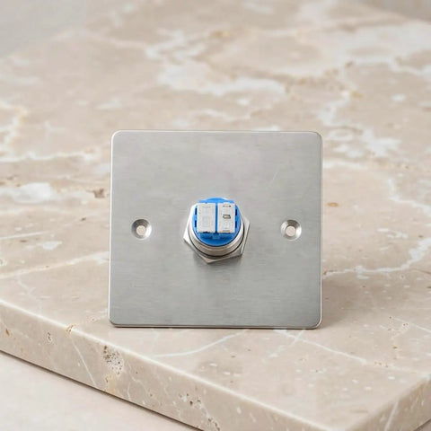 Stainless Steel Emergency Stop Push Button Panel Mount Switch Built Like A Tank For Heavy Duty Industrial Machine Control With Instant Safe Shutdown No Nonsense Workhorse Gear on a surface with visible mounting holes.