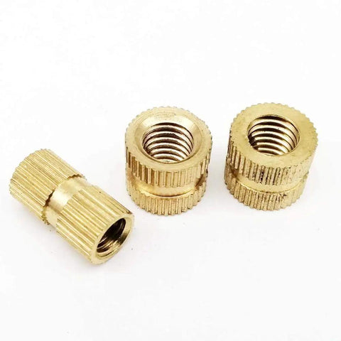 Premium Solid Brass Insert Nuts With Metric Thread For Injection Molding Projects Available In M3 M4 M5 And M6 Sizes, close-up view.