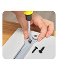Person using a screwdriver with 100 Piece Pack Of Size 6 By Half Inch Black Phillips Flat Head Wood Screws for installation.
