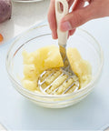 Top Rated Stainless Steel Potato Ricer And Masher Set With Sturdy Ergonomic Handles For Comfortable Handling And Quick Cleaning Perfect For Silky Baby Food And Weeknight Veggie Purees; mashing potatoes in glass bowl.