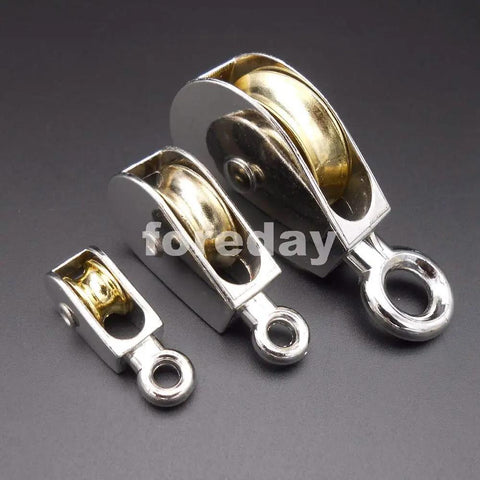 Premium 75Mm Zinc Alloy Window Roller Pulley Featuring Rock Solid Build And Butter Smooth Glide Versatile Fixed Lifting Hoist Wheel For DIY Projects And Rigging Runs Complemented By A Dope Ten Piece Pack in three size variations on black background.