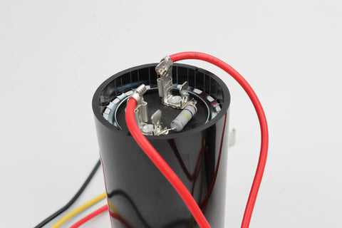 Inside view of AC Hard Start Capacitor Kit For 3 To 5 Ton Air Conditioning Units with wires and components.