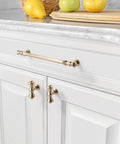 10 Pack Brushed Brass Cabinet Pulls Featuring Seven Point Five Inch Center To Center Spacing on white kitchen cabinets