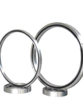 Top Notch RA17013 RA17013UUCC0 RA17013UUC0 Cross Roller Slewing Bearing, two sizes, designed for steady loads in robotics and machinery.