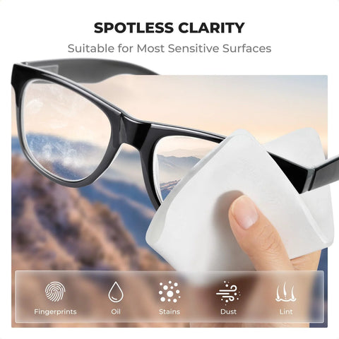 Lens cleaning microfiber cloth; white cloth used to wipe black eyeglasses (close-up).