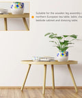 Heavy Duty Iron Furniture Leg Mounting Plates For Sturdy Tables And Couches No Sweat Install Repair Kit Solid Sofa Leg Brackets Built Like A Tank For Everyday Use on a round wooden table with plant, books, and decorative bowl.