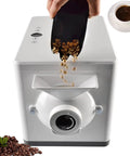 No Sweat Automatic Coffee Bean Roaster Featuring One Click Roast Cycle And Precision Temperature Controls For Even Browning and Top Shelf Flavor For Commercial Cafes, loading green beans.