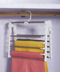 Heavy Duty Foldable Multi Layer Pants Hangers Crafted From Durable Stainless Steel for organizing colorful pants in closet.