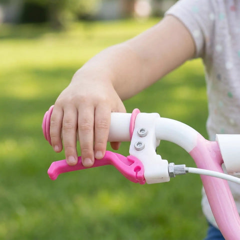 Child hand using Kids Bike Brake Lever Set, 2 Pack Universal Brake Handles for Kids Bikes, rosy plastic levers on handlebars