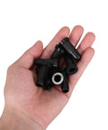 Fifty Pack Black Nylon Caster Stem Socket Sleeve With Secure Grip Neck For Office Chair Leg Swap Bushing and furniture foot cap in hand.