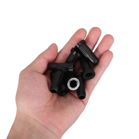 Fifty Pack Black Nylon Caster Stem Socket Sleeve With Secure Grip Neck For Office Chair Leg Swap Bushing and furniture foot cap in hand.